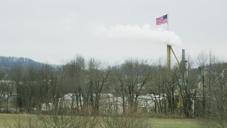 pollution engulfs american flag smoke stack factory