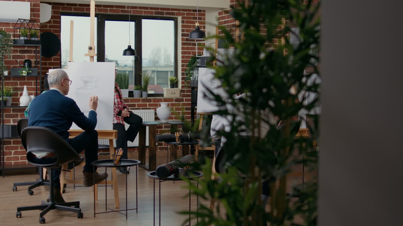 Diverse group of people attending drawing lesson in art class