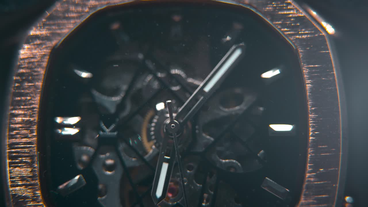 A macro slose-up shot of a mechanic hand watch, vintage technology, retro mechanism, octagon goden design, cinematic studio lighting, commercial footage, smooth detailet 4K video, tilt down