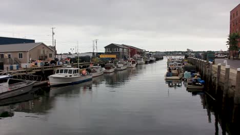 lobster and fishing boats moored in portland, harbor.  portland, maine attracts a lot of tourists to it's working harbor.
