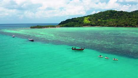 tropical island aerial view. camera flies over the shore and the beach of the tropical island