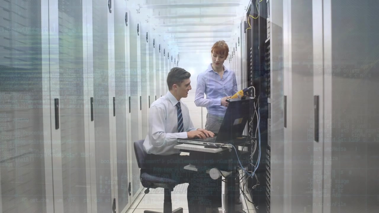 Animation of data processing over caucasian male and female it technicians and computer servers