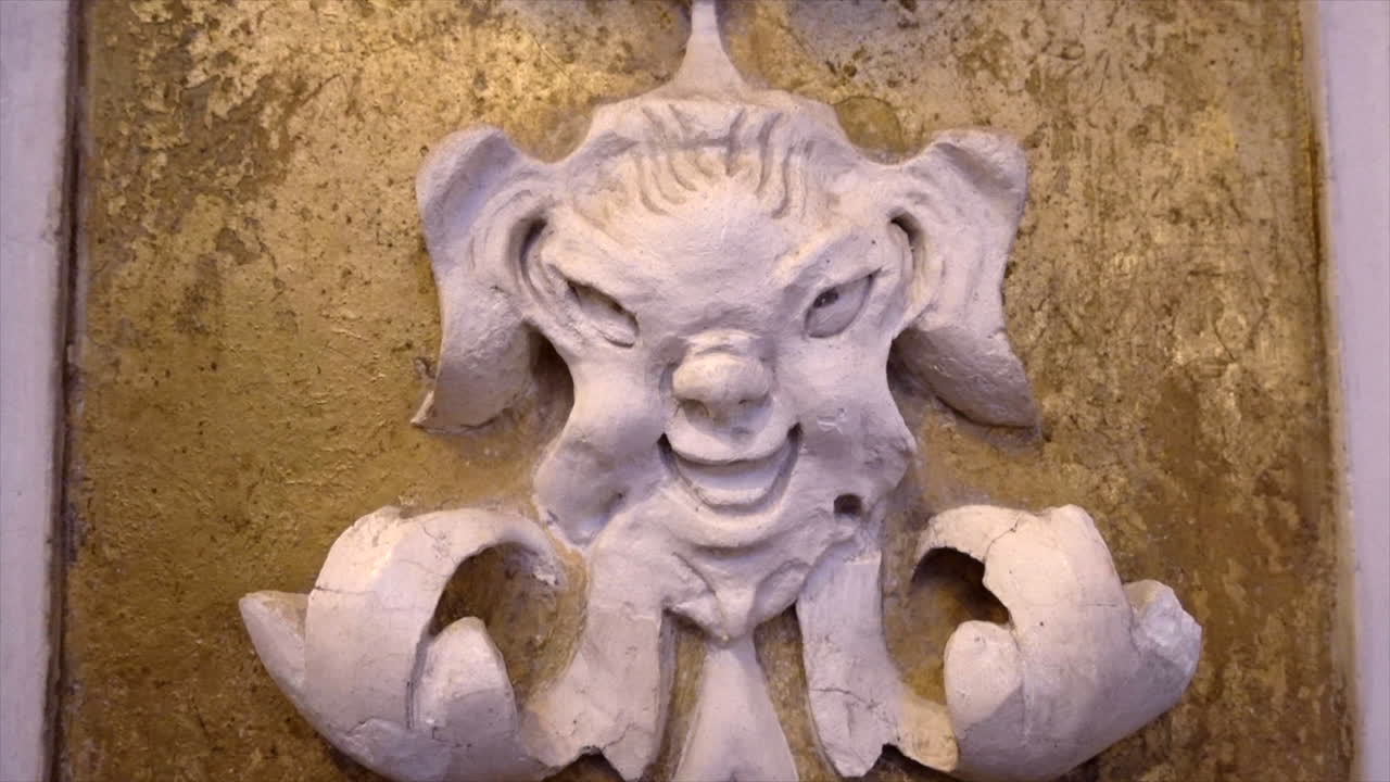 Stuccoes and statues inside the Serpotta Chapel of Castelbuono Castle, Sicily. Angels, devils, and fierce demonic faces decorate this masterpiece, showcasing Baroque artistry at its finest.