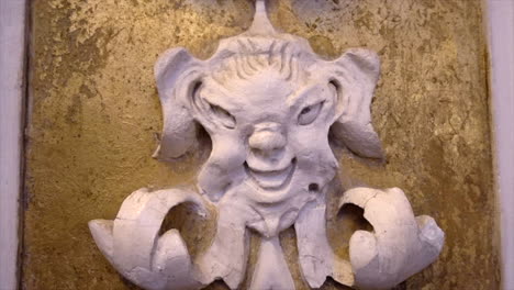 stuccoes and statues inside the serpotta chapel of castelbuono castle, sicily. angels, devils, and fierce demonic faces decorate this masterpiece, showcasing baroque artistry at its finest.