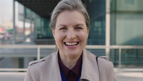 portrait-of-middle-aged-business-woman-laughing-happy-enjoying-corporate-career-in-city