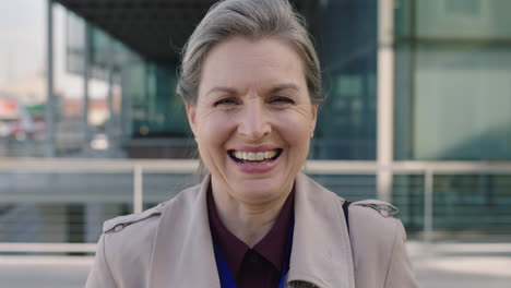 portrait of middle aged business woman laughing happy enjoying corporate career in city