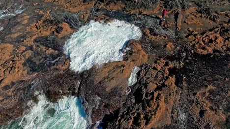 Located-in-the-Cape-Perpetua-Scenic-Area,-just-three-miles-south-of-Yachats-Oregon,-Thor's-Well-is-a-bowl-shaped-hole-carved-out-of-the-rough-basalt-shoreline