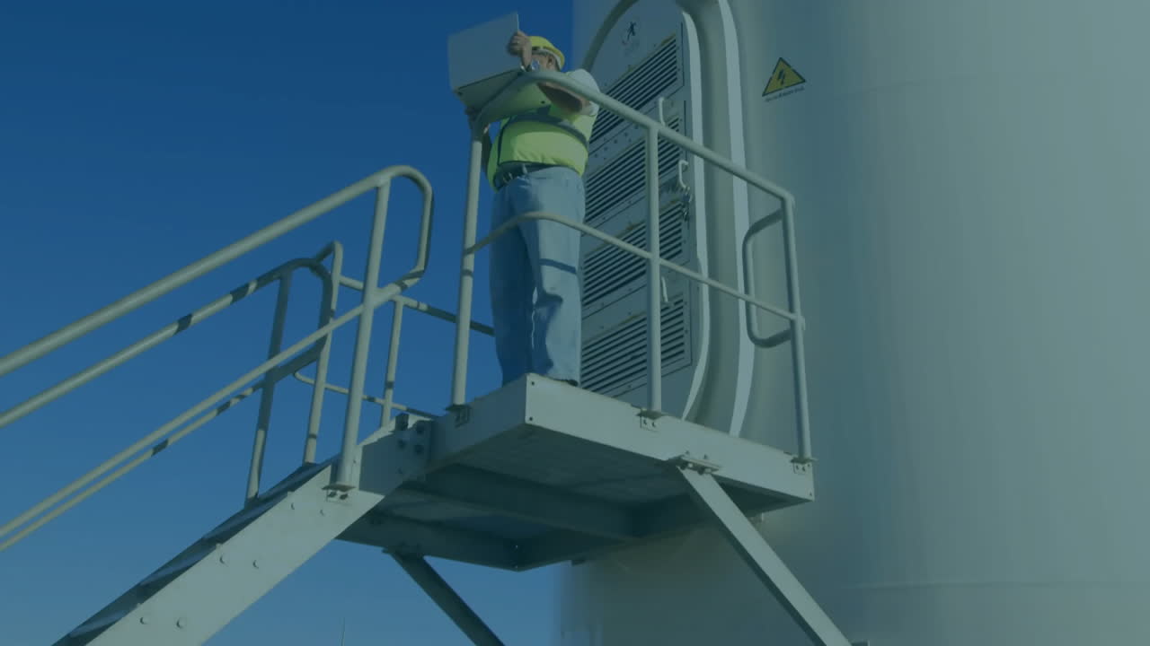 풍력 터빈의 애니메이션, 남성 엔지니어 및 금융 데이터 처리