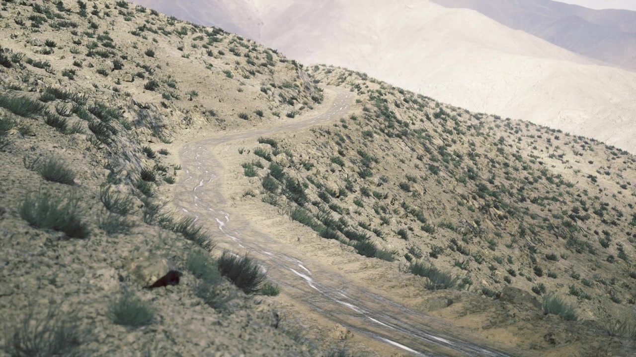Landscape with erosion scarred afghan slope featuring subtle pastel shades