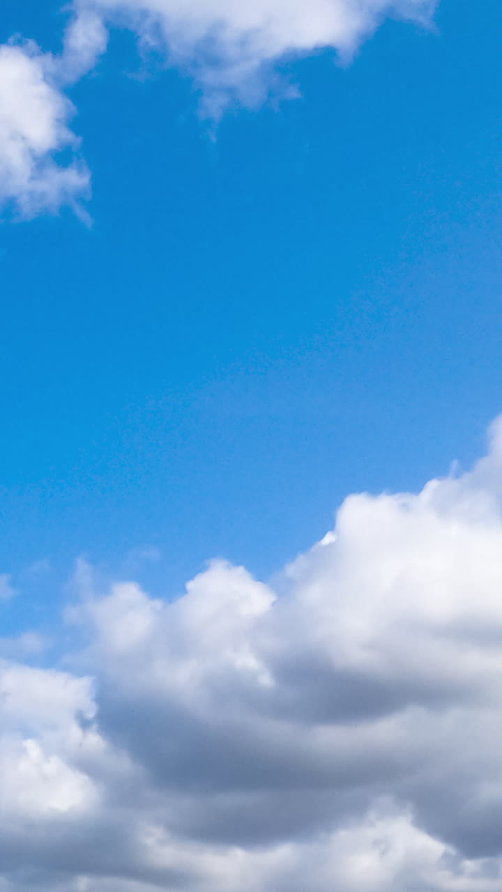 Light clouds on blue bright sky. Summer sky motion of cloudscapes.
