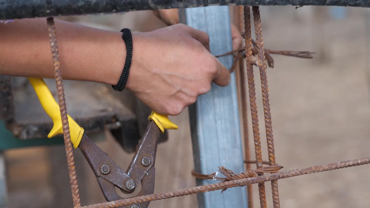 Close up repairing the wire fence