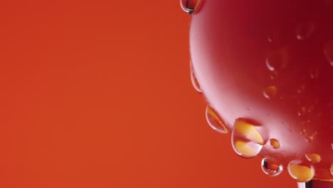 water droplets on a red tomato