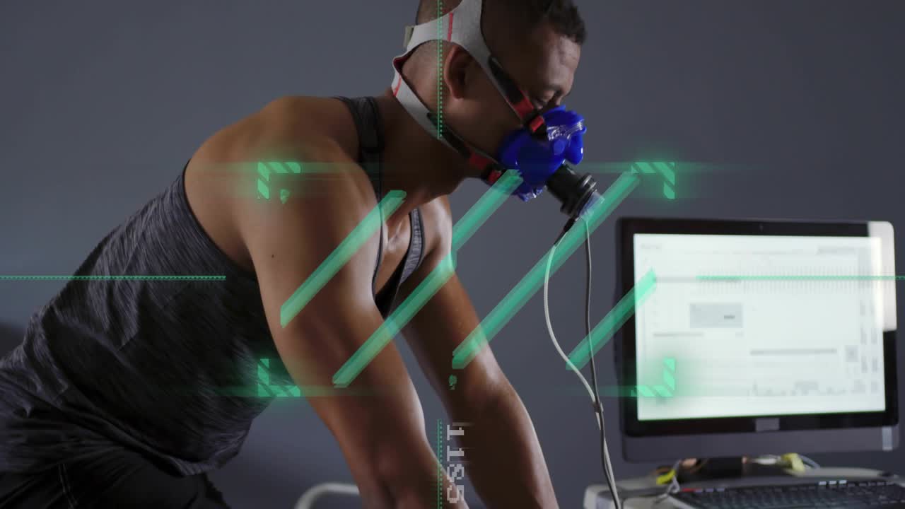 Male cyclist starting pedaling on stationary bike in VO2 lab, mask fitted, telemetry updating