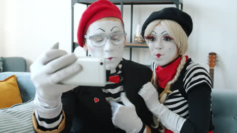 mime couple taking a selfie