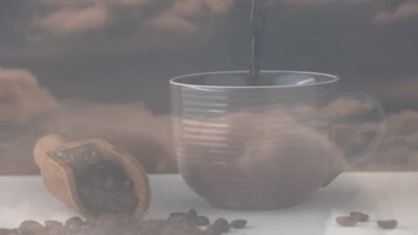 ridged ceramic mug receiving streaming dark coffee, wooden scoop spilling beans on white surface