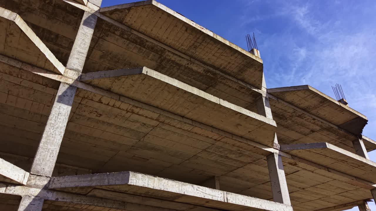 Interesting view of a concrete structure by the sea, highlighting its architectural design and surroundings during a clear day