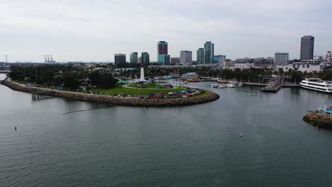 Aerial-view-toward-an-event-at-the-Lion-Lighthouse,-in-cloudy-Long-beach,-USA