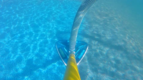 time lapse of cleaning dirty pool with vacuum underwater on pole shot