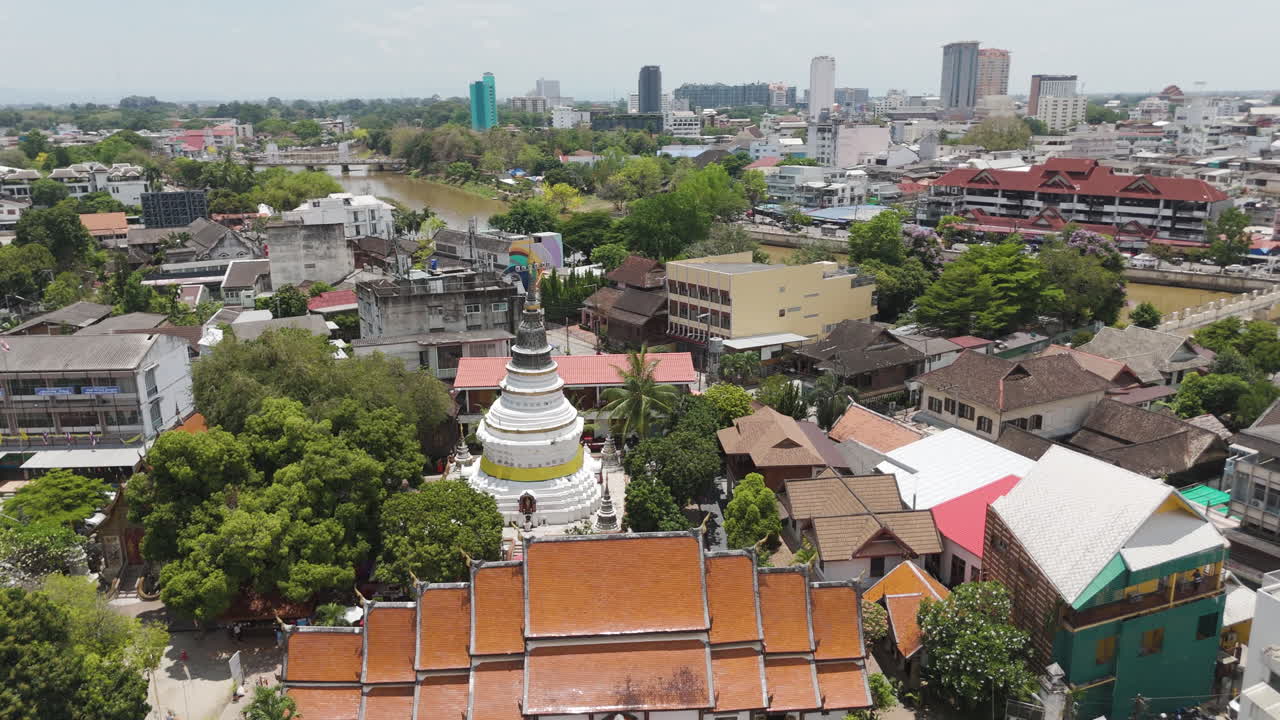 White Stupa Of Wat Ket Karam Buddhist Temple In Chiang Mai, Thailand. Aerial Drone Shot