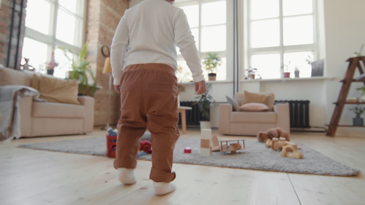 Toddler Boy Walking in Living Room