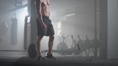 Young-man-exercising-using-skipping-rope-in-gym.-Athletic-man-training-hard-at-the-gym.