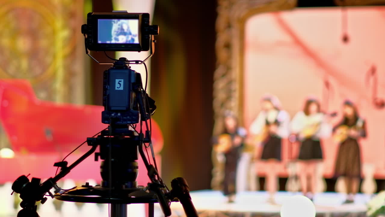 Professional camera filming with on the backstage of a TV set