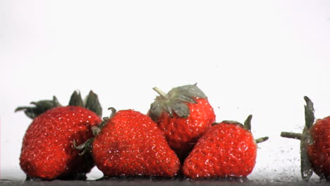 water drops in super slow motion falling on fruits