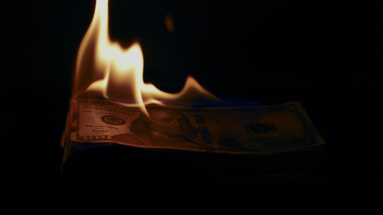 Burning Money: A Symbol of Financial Loss and Crisis