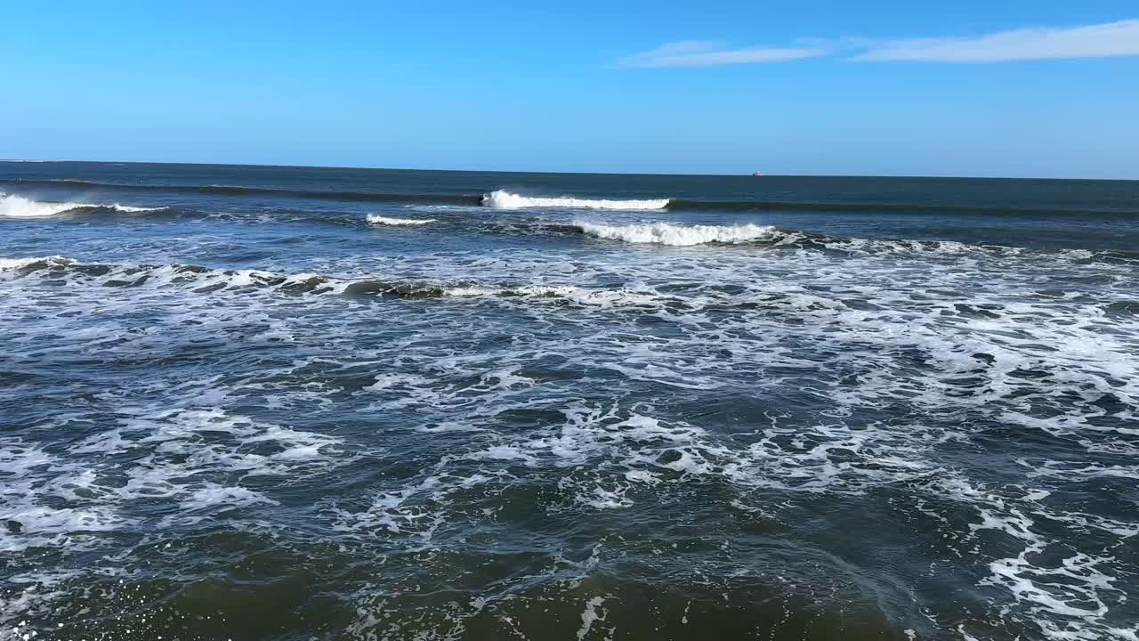 North sea waves crashing onto the shore north east england sunderland british coastline
