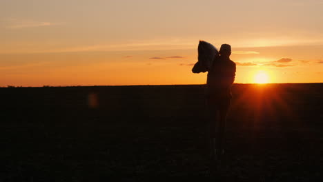 farmer at sunset