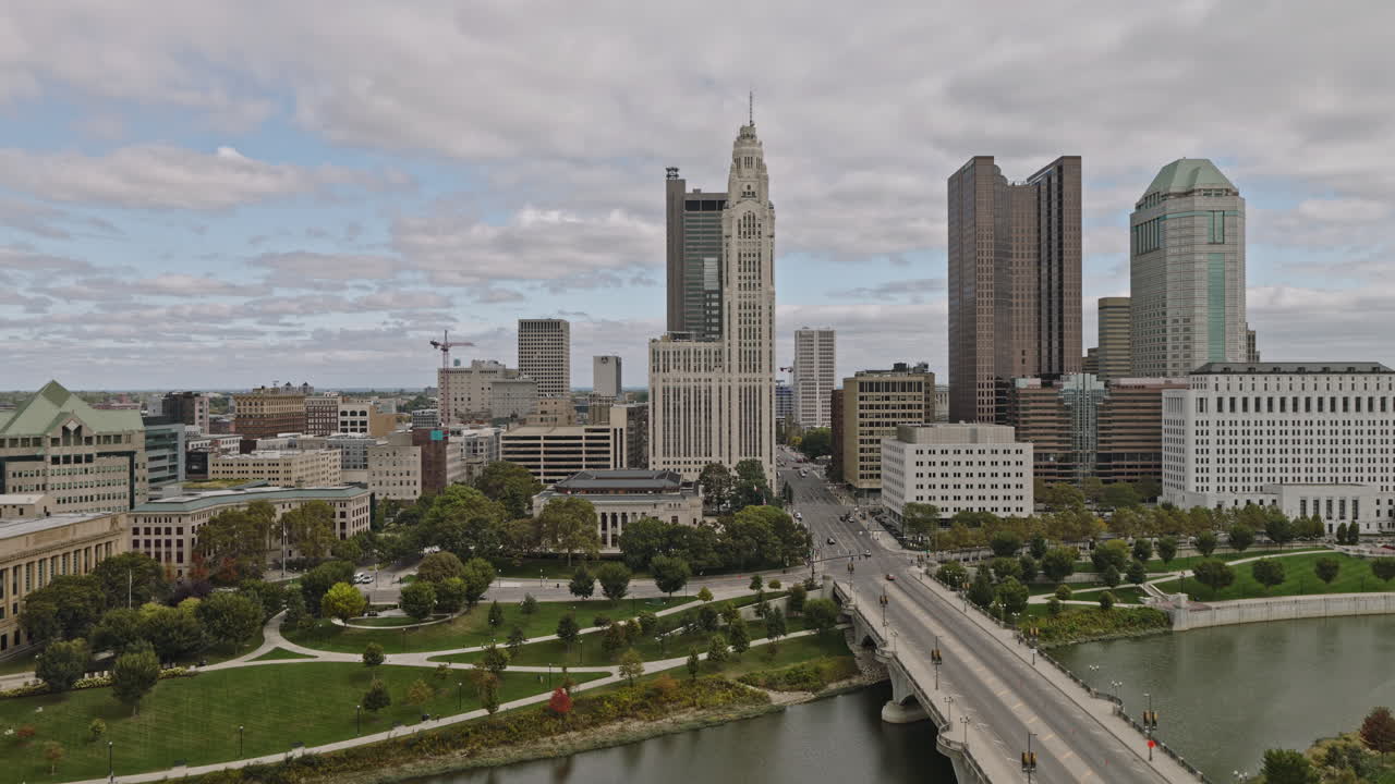 Columbus Ohio Aerial v48 low drone flyover Scioto River along Discovery bridge capturing Battelle riverfront park, city council building, downtown cityscape - Shot with Inspire 3 8k - Sept 22nd 2023