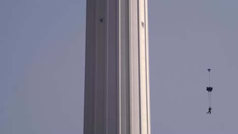 base jumpers jumping from menara tower in kuala lumpur.