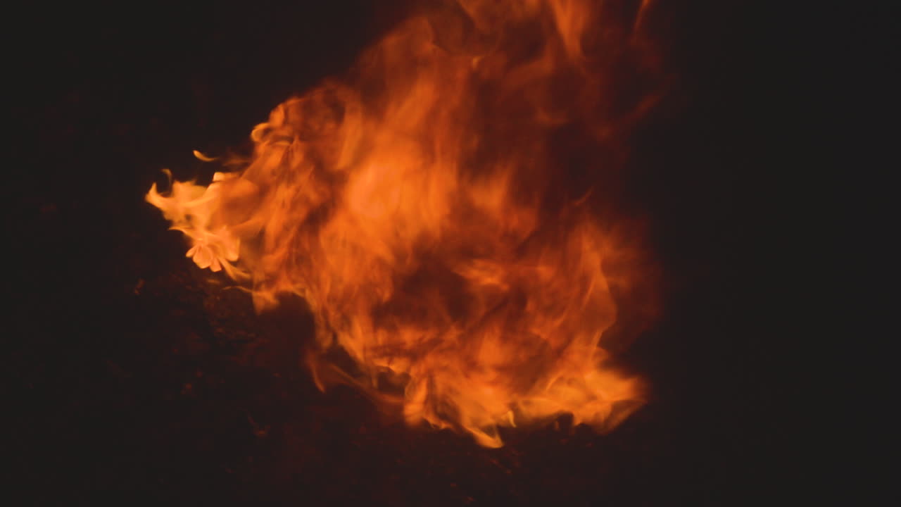 Raging gasoline fire is out of control. Black smoke rises from the burning gas