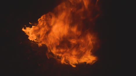 raging gasoline fire is out of control. black smoke rises from the burning gas