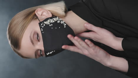 woman in beaded face mask posing