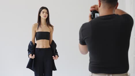 fashion photoshoot with a model and a photographer in a studio