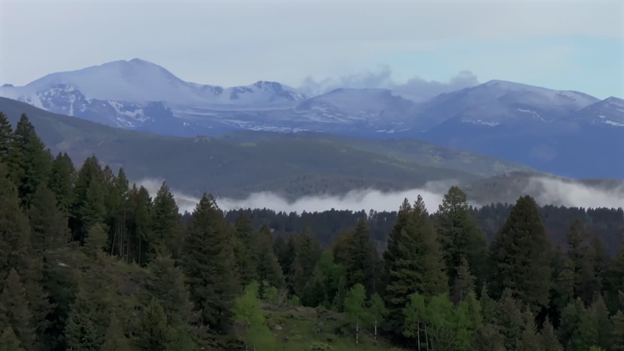 Foggy morning Front Range Rocky Mountains Mount Blue Sky Evans foothills valley of Evergreen Colorado aerial drone summer spring Conifer Bailey Arapaho National Forest clouds circle right parallax