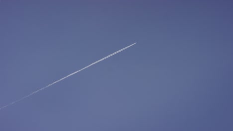 airplane contrails in a blue sky