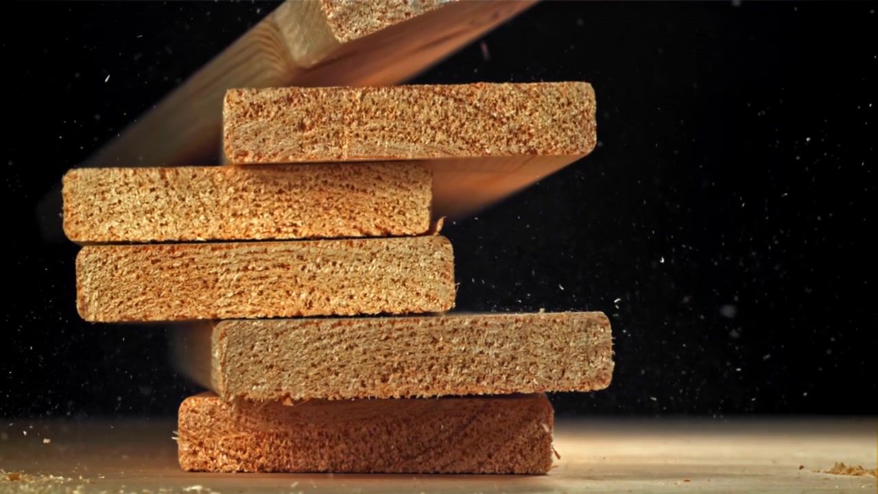 Slow Motion of Wooden Planks Falling and Stacking with Sawdust