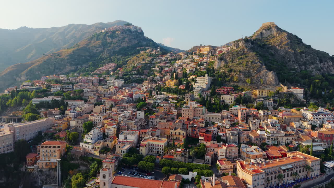 Aerial view of Taormina, Sicily, vibrant town nestled in stunning hills