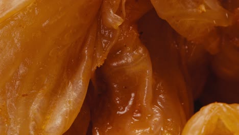 close-up of texture fermented spicy cabbage kimchi with in can. preservation of vegetables in glass jars. fermentation preserved kimchi cabbage with spices macro. asian cuisine.