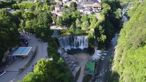 aerial establishing shot of beautiful pliva waterfall in jajce