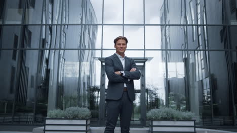 smiling financial consultant standing at modern office portrait. success concept