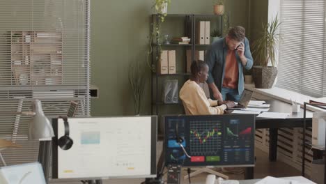 two brokers working together in office