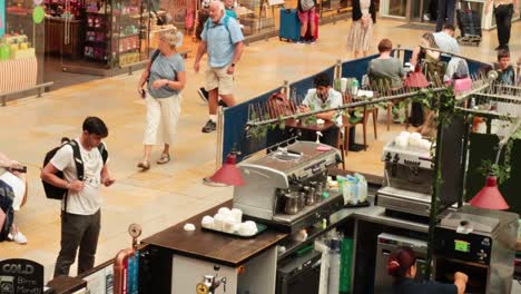 people interacting at a coffee kiosk