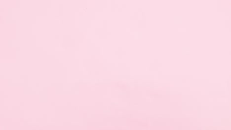 slices of oranges and limes come from all the sides of pink theme. stop motion