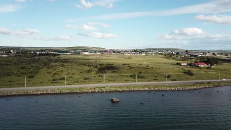Aerial View of Coastal Road Outside of Puerto Natales, Chile. Sea Port and Getaway to Torres Del Paine National Park Under Summer Sky