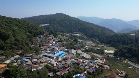 slow motion drone view over rural mountain village in northern thailand