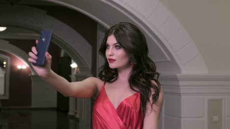 woman taking selfie in a hotel hallway