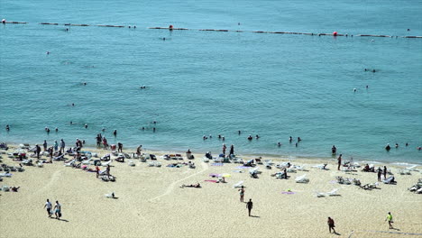 Crowd-of-Western-Tourist-on-a-private-hotel-seaside-beach-resort-in-South-East-Asia-enjoying-and-relaxing-in-the-hot-sun-sea-sand-vacation